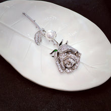 Load image into Gallery viewer, Romantic Vintage Silver Brooch with Mother of Pearl Deco and Long Stem White Rose Buds – Perfect Wedding Accessory
