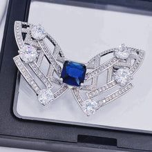 Load image into Gallery viewer, Modern Art-Inspired Butterfly Geometric Brooch Pins with Blue Stone – Silver-White Bow Design

