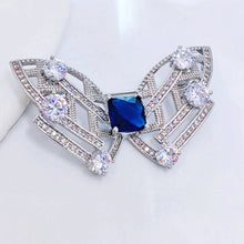 Load image into Gallery viewer, Modern Art-Inspired Butterfly Geometric Brooch Pins with Blue Stone – Silver-White Bow Design
