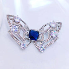 Load image into Gallery viewer, Modern Art-Inspired Butterfly Geometric Brooch Pins with Blue Stone – Silver-White Bow Design
