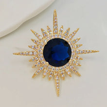 Load image into Gallery viewer, Shiny CZ Sunburst Brooch Pin, Deep Blue Center Stone, Gold Tone with Rhinestones

