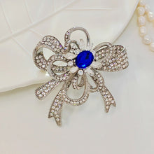 Load image into Gallery viewer, Gorgeous Silver - toned Bow - shaped Brooch with Large Blue Stone and Crystal Embellishments
