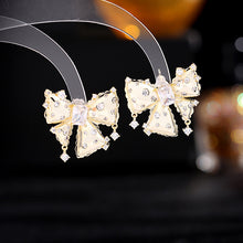 Load image into Gallery viewer, Jewelblings Vintage Gold Metal Ribbon Green Stone Center Bow Stud Earrings with Clear Stone Accent
