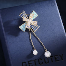Load image into Gallery viewer, Jewelblings Designer Gold Tone Two Layered Cross Domed Windmill Brooch Pin with Pearl Drop
