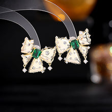 Load image into Gallery viewer, Jewelblings Vintage Gold Metal Ribbon Green Stone Center Bow Stud Earrings with Clear Stone Accent
